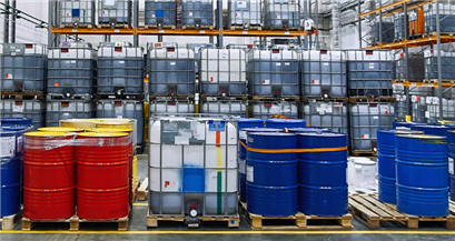 Barrels of different industrial degreasing solutions in the warehousehe